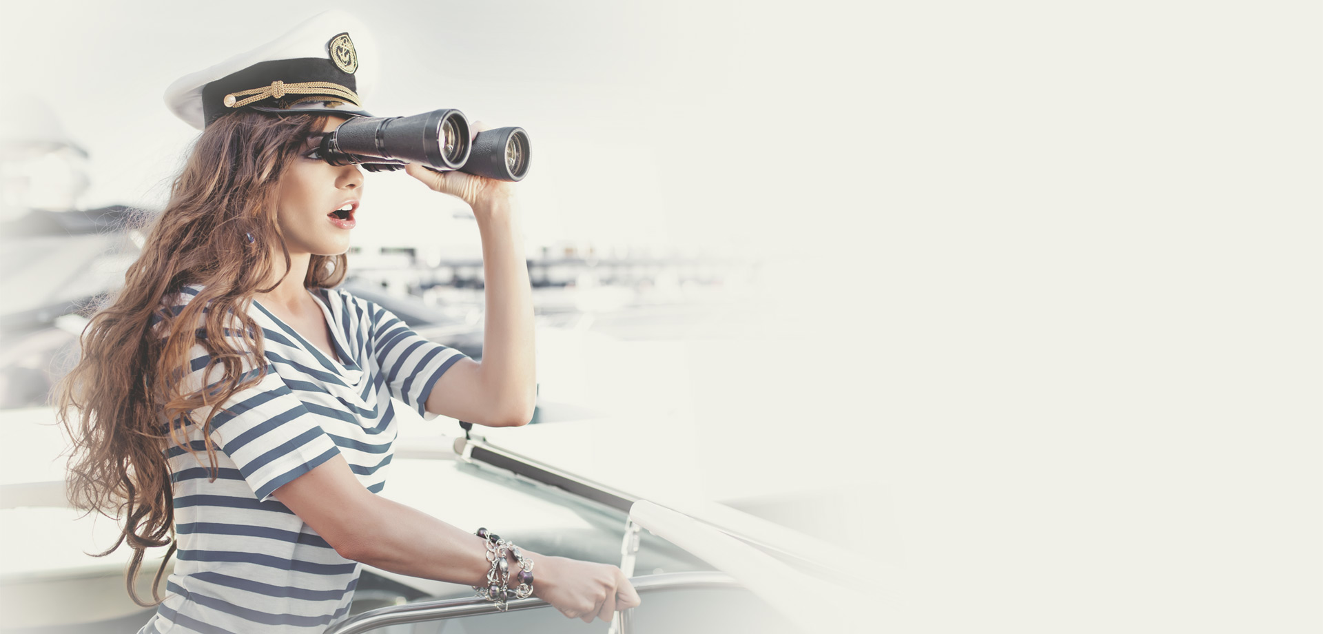 Sailor with binoculars on a liveaboard