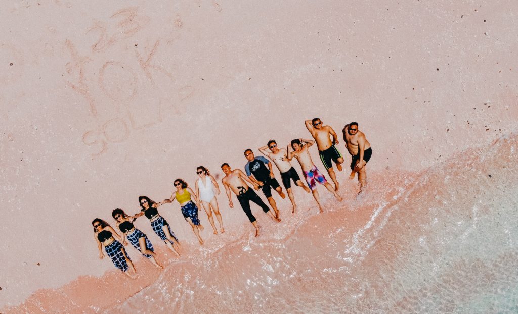 relax in pink beach with friends