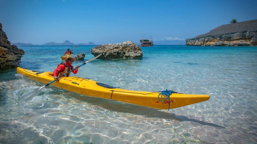 sea kayaking in komodo island's blue water